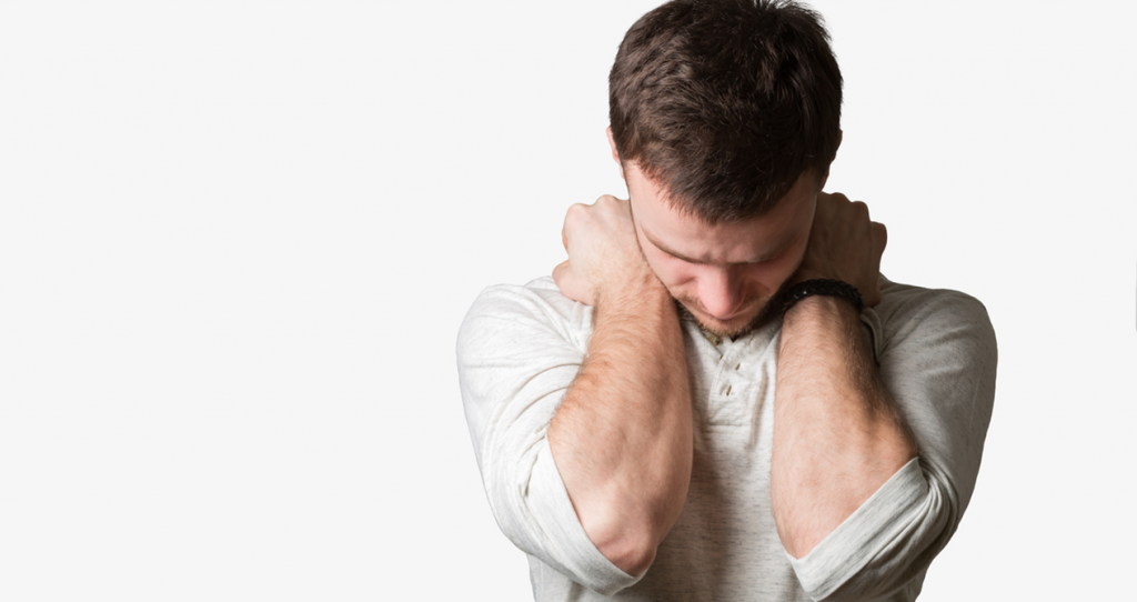 Man with his head bowed and arms folded across his chest